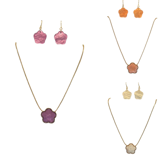 Elevate your ensemble with our Flower Accent Jewelry Set crafted in lustrous gold. This sophisticated pairing features a coordinating necklace and earrings with delicate floral design elements. Available in three elegant colorways—peach, purple, and white—to complement any wardrobe. Each set provides versatile styling options for both everyday wear and special occasions.