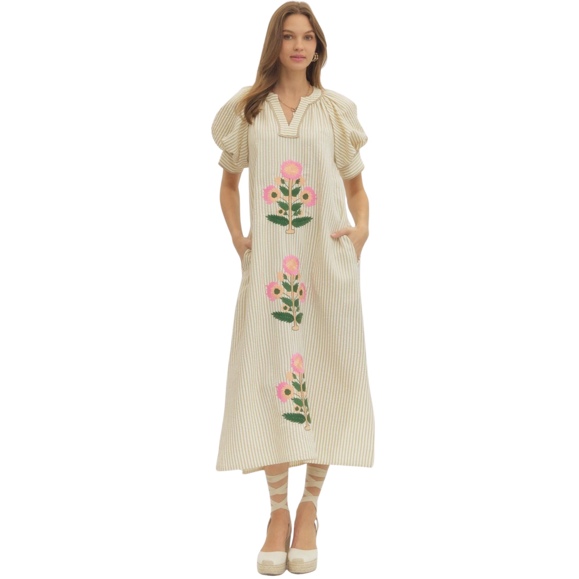 Elevate your wardrobe with this sophisticated V-neck maxi dress from Entro, crafted in a warm oatmeal tone that complements all skin tones. Delicate flower embroidery adorns the fabric, adding refined texture and visual interest to this timeless silhouette. The flowing maxi length provides elegant coverage while the V-neckline creates a flattering, elongating effect. Perfect for special occasions, garden parties, or elevated everyday wear, this dress seamlessly transitions from season to season.