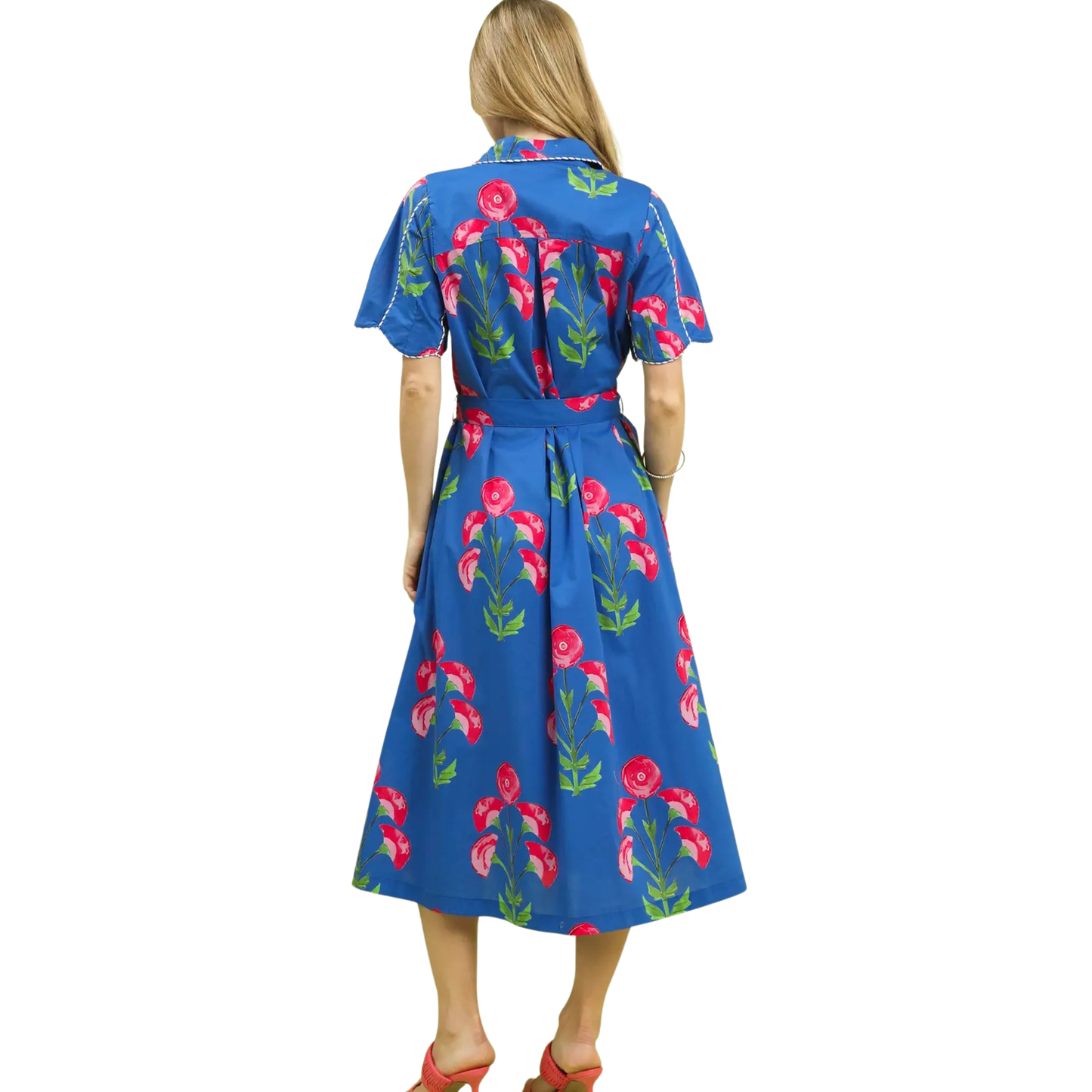 This Umgee midi dress combines refined tailoring with botanical charm. The blue floral print provides visual interest while maintaining sophistication, complemented by a structured collar and functional button-front closure. The midi length creates a balanced proportion suitable for various body types and occasions. Quality construction and thoughtful design details make this a versatile investment piece that works equally well for professional settings or weekend gatherings.