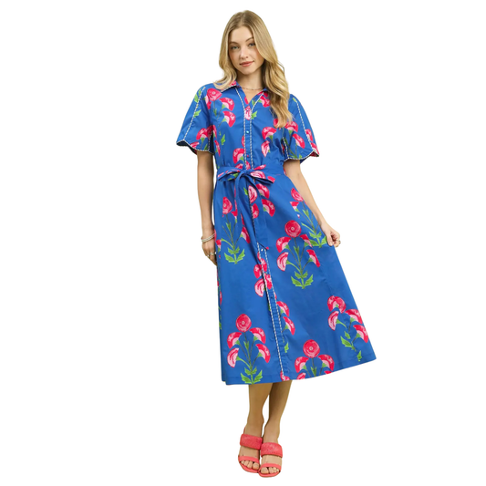 This Umgee midi dress combines refined tailoring with botanical charm. The blue floral print provides visual interest while maintaining sophistication, complemented by a structured collar and functional button-front closure. The midi length creates a balanced proportion suitable for various body types and occasions. Quality construction and thoughtful design details make this a versatile investment piece that works equally well for professional settings or weekend gatherings.