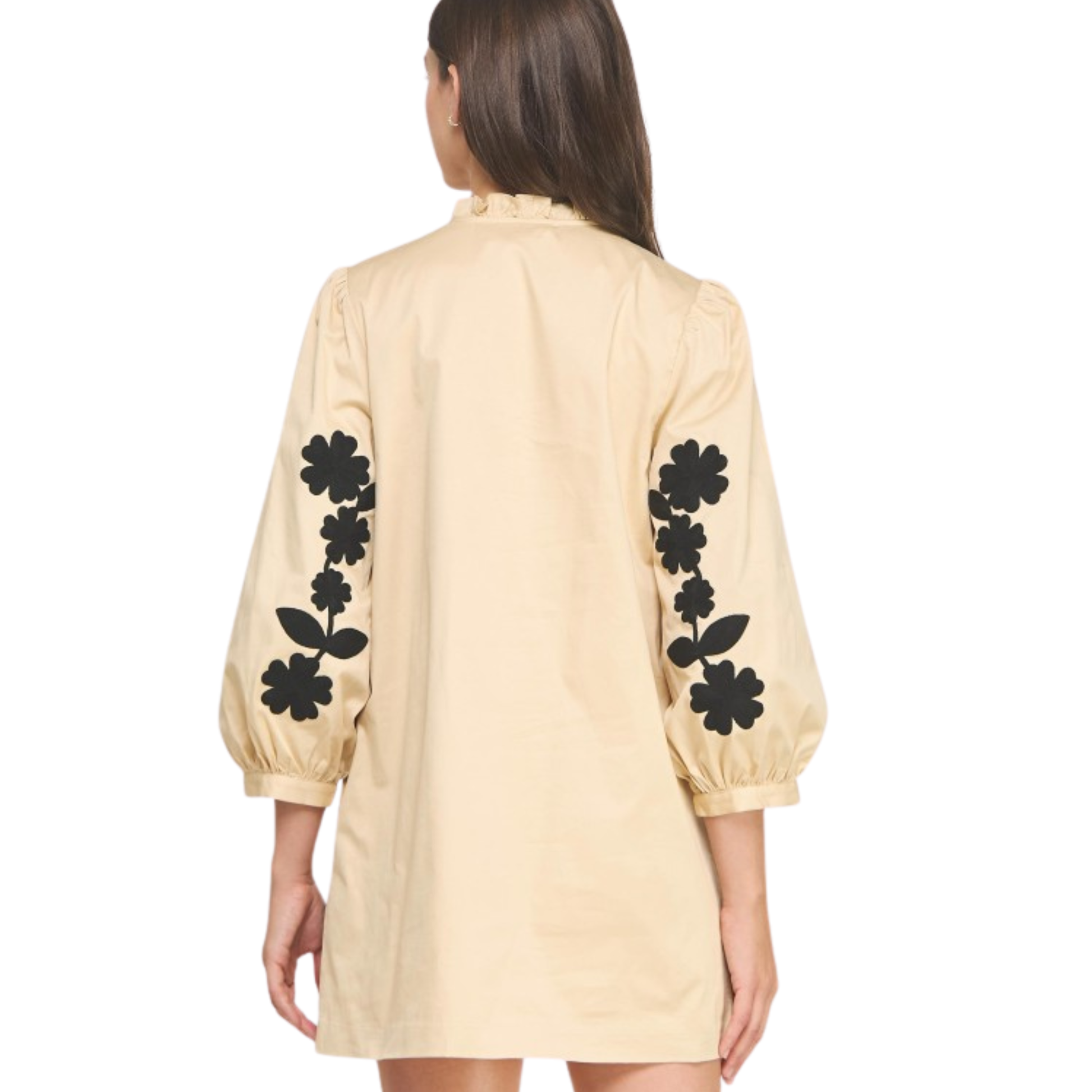 This Strut &amp; Bolt mini dress combines sophisticated design with playful details. Featuring delicate flower embroidery on the sleeves, it adds a touch of artistry to the black and sand color palette. The ruffle neck enhances its feminine silhouette, making it perfect for stylish daytime events or evening outings. Crafted for a flattering fit, this dress balances elegance and comfort effortlessly.