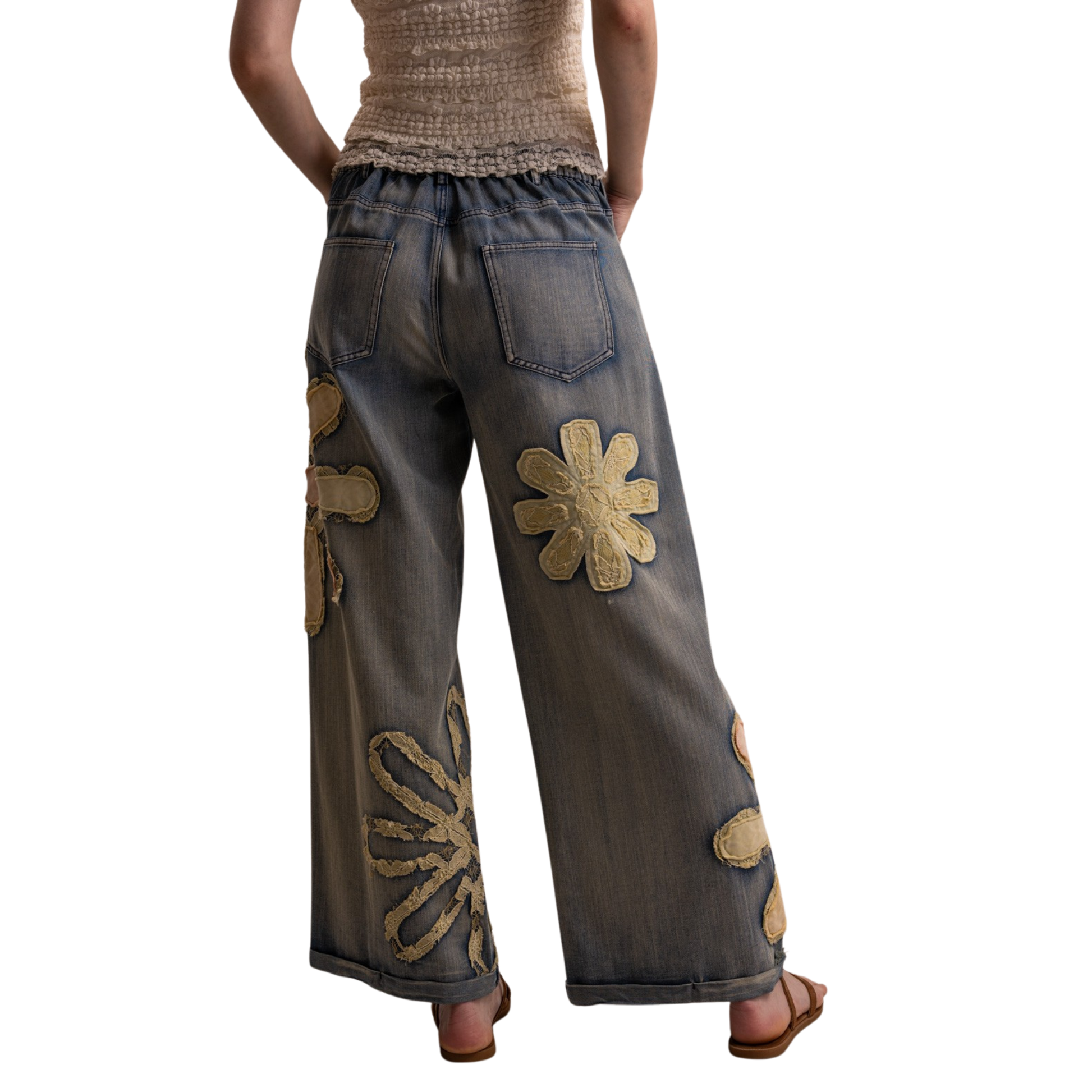 Elevate your denim collection with these stunning wide-leg flower patch pants from Blue Velvet. The relaxed silhouette offers comfort and style, while the eye-catching floral patches add a unique, artistic touch to your everyday look. Perfect for casual outings or making a statement at social gatherings. Crafted for those who appreciate quality and individuality in their wardrobe.
