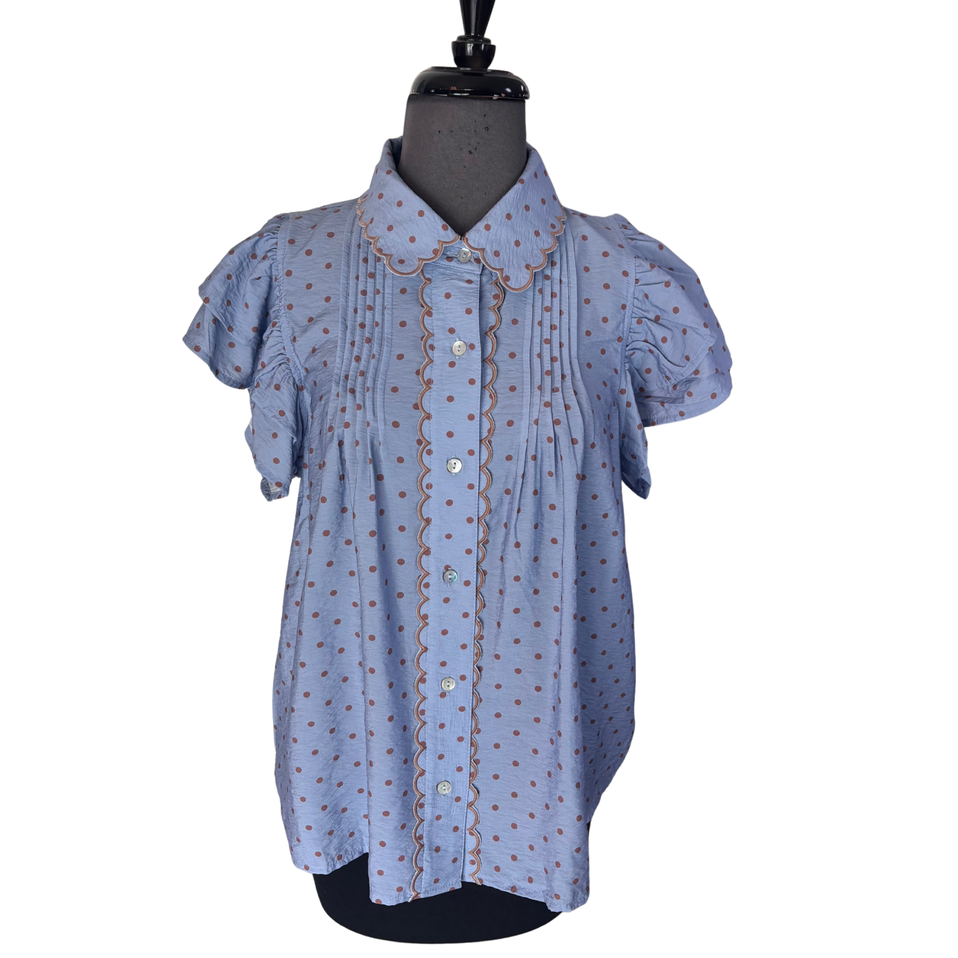 Elevate your wardrobe with this charming Flutter Sleeve Top by Entro. Featuring delicate flutter sleeves and a classic button-up design, this short-sleeve blouse combines playful style with everyday versatility. The eye-catching blue base adorned with brown polka dots adds a vintage-inspired touch perfect for casual outings or dressed-up occasions. Soft, comfortable fabric makes it an instant favorite for any season.