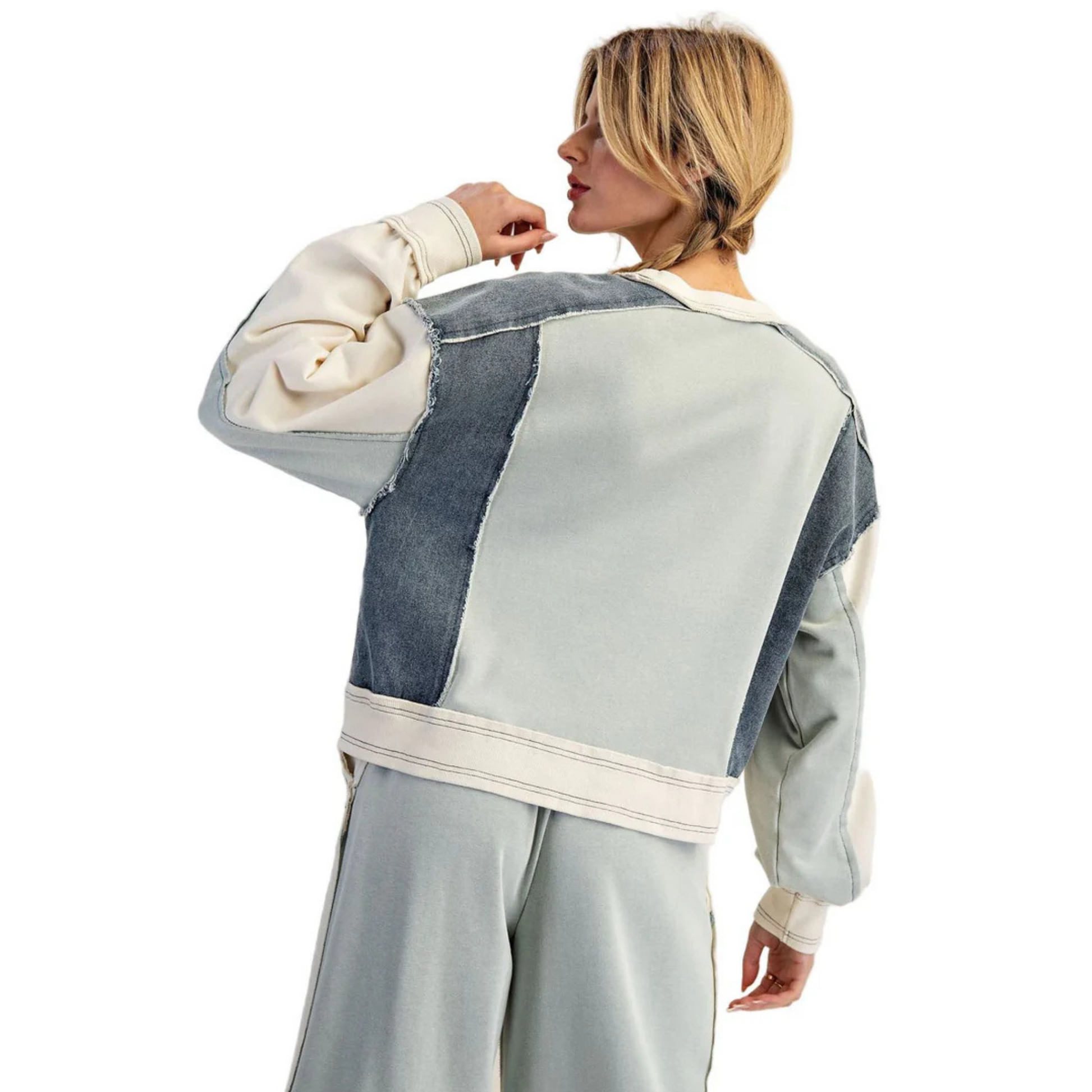 This set features a sophisticated blend of blue shades in a color-block design, combining a long sleeve top with denim-colored drawstring pants. The top’s varied blue tones enhance visual interest while providing comfortable coverage, and the adjustable drawstring pants ensure a perfect fit with casual ease. Ideal for those seeking a stylish yet relaxed outfit that balances modern design with everyday comfort.