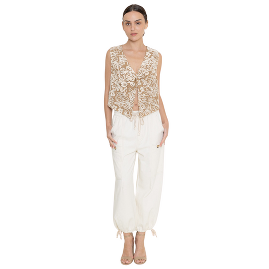 Embrace comfort and style with these ivory Elastic Waistband Casual Pants from the Fore collection. Featuring practical front pockets and a customizable drawstring hem, these pants offer both functionality and a personalized fit. Perfect for casual outings or relaxed days at home, they combine everyday versatility with thoughtful design elements.