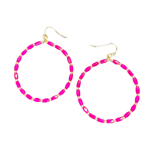 These dangle earrings are expertly crafted in hoops design and feature a vibrant fuchsia color. Elevate your style with these statement earrings, adding a pop of color to any outfit. Made to be noticed and admired, these colored hoops are a must-have for any fashion-forward individual.
