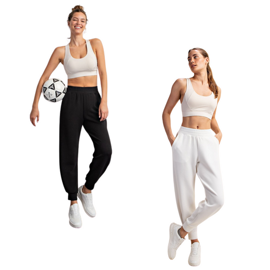 Discover unmatched comfort in our Easy Pull-On Joggers. Designed for effortless style, these joggers boast an elastic waist and luxurious cooling scuba fabric. The bottom side pleat detail adds a touch of elegance, while side pockets enhance functionality. Perfect for lounging, city outings, brunch, and summer adventures, pair these chic joggers with matching tops for a versatile and stylish ensemble. Elevate your wardrobe with comfort and fashion seamlessly combined. Available in white and black.