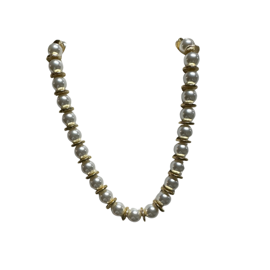 Elevate your everyday elegance with this refined pearl necklace from Perdido Gems. Featuring lustrous pearls complemented by delicate gold accents, this short-length piece offers versatile styling for both casual and formal occasions. The expert craftsmanship showcases the natural beauty of premium pearls while the gold detailing adds a touch of sophisticated luxury. A timeless investment piece that transitions seamlessly from day to evening wear.