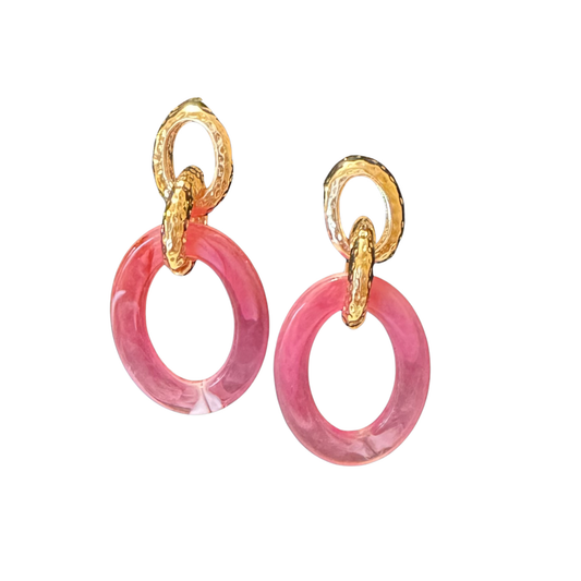 Garden Party's acrylic hoop earrings combine timeless elegance with contemporary flair. These lightweight gold and pink combo hoops offer versatile styling for any occasion—from casual daytime wear to evening sophistication. The durable acrylic construction ensures comfortable all-day wear without compromising on visual impact. Perfect for those seeking statement pieces that balance bold color with refined simplicity.