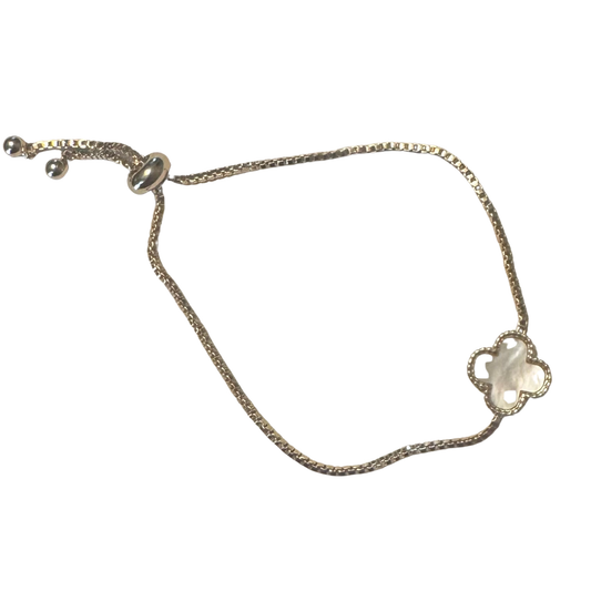 Elevate your wrist with this exquisite adjustable clover bracelet from Perdido Gems. Crafted with lustrous gold accents, the delicate four-leaf clover design symbolizes fortune and elegance. The adjustable fit ensures a comfortable wear for any occasion, whether layered with other pieces or worn as a standalone statement. Perdido Gems' expert craftsmanship delivers timeless sophistication in every detail.