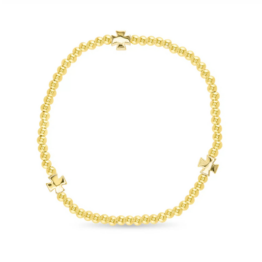 Elevate your accessory collection with this Gold Bead Large Bracelet from Amanda Blu. Featuring elegant gold cross accents and shimmering gold beads, this stretchy bracelet combines style with comfort. Its flexible design ensures a perfect fit for all-day wear, making it a sophisticated addition to any outfit.