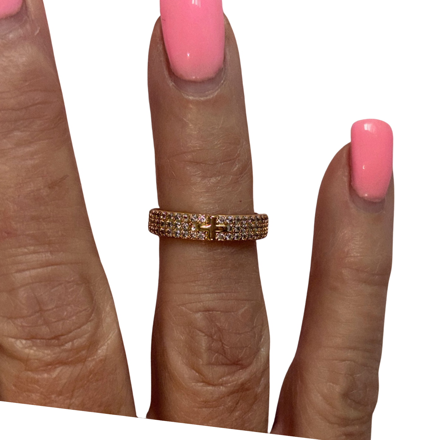 Elegant cross ring featuring a striking gold finish with shimmering rhinestone accents that catch the light beautifully. The classic cross design makes a bold spiritual or fashion statement, perfect for everyday wear or special occasions. Crafted by Perdido Gems, this piece combines timeless symbolism with contemporary sparkle. A versatile addition to any jewelry collection that pairs effortlessly with both casual and formal outfits.