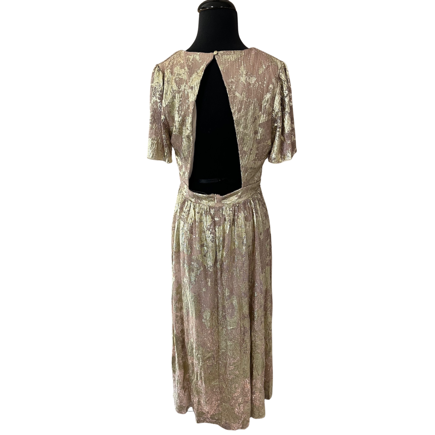 Elevate your wardrobe with this sophisticated Gold Foil Midi Dress by B.right. Featuring an eye-catching gold foil design against a refined taupe base, this piece seamlessly transitions from day to evening. The graceful flutter sleeves add movement and elegance, while the midi length offers timeless versatility. Crafted with expert attention to detail, this dress delivers both style and wearability for the discerning dresser.