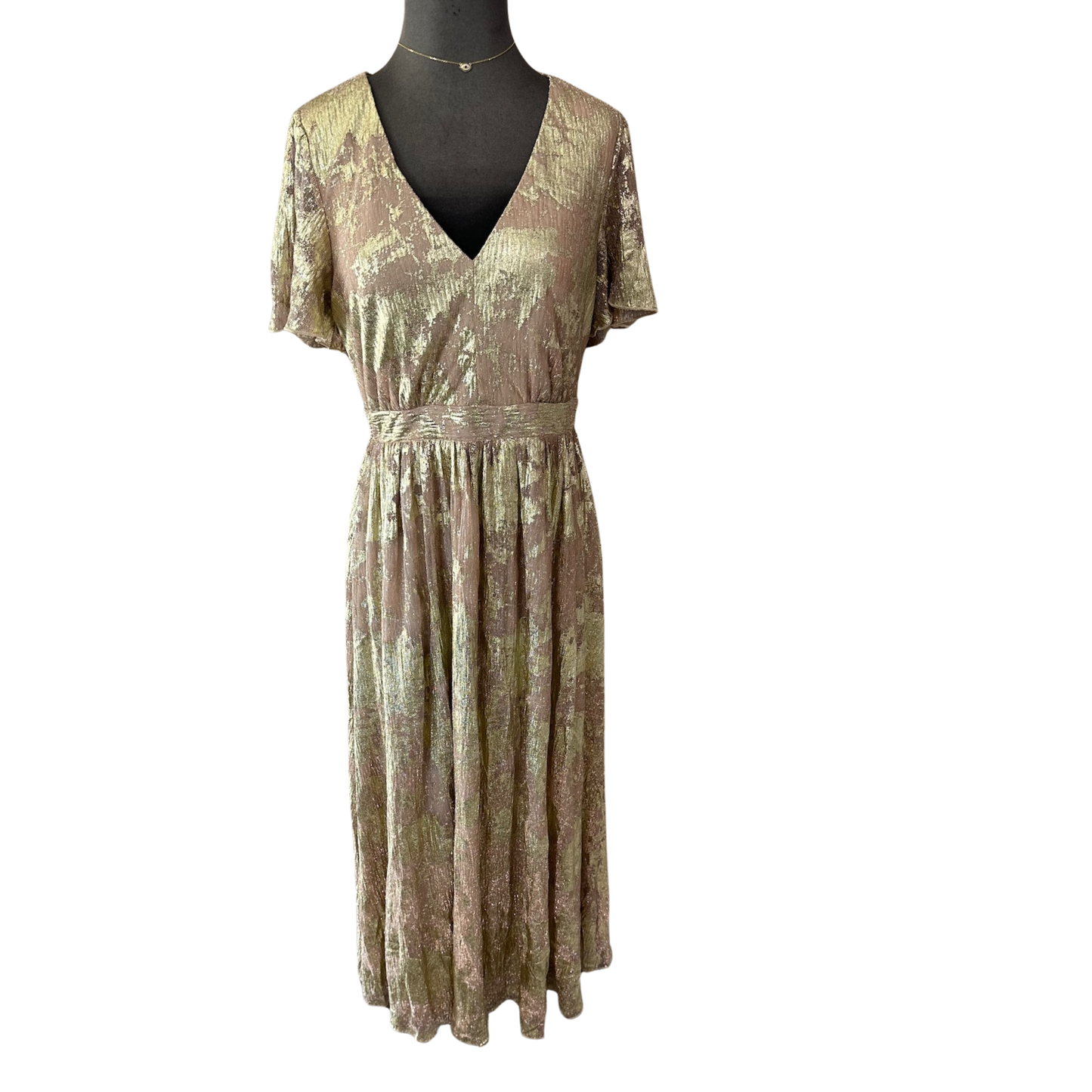 Elevate your wardrobe with this sophisticated Gold Foil Midi Dress by B.right. Featuring an eye-catching gold foil design against a refined taupe base, this piece seamlessly transitions from day to evening. The graceful flutter sleeves add movement and elegance, while the midi length offers timeless versatility. Crafted with expert attention to detail, this dress delivers both style and wearability for the discerning dresser.