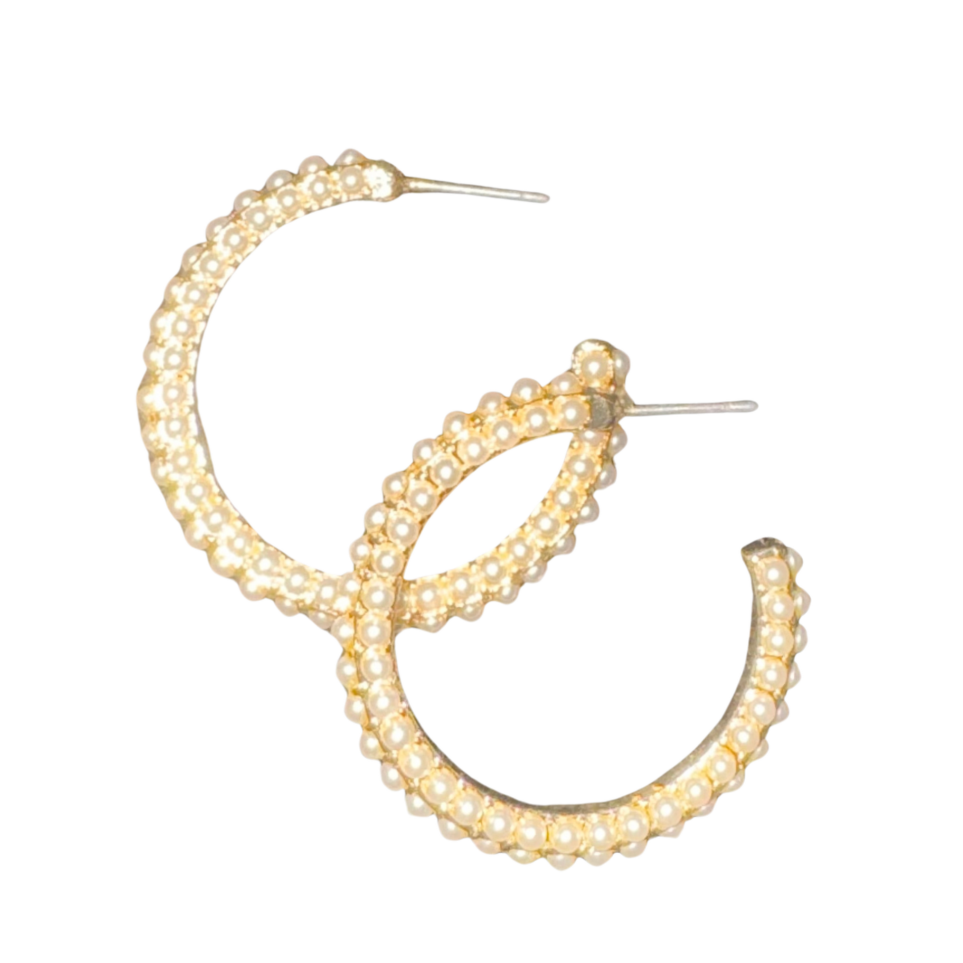 Handcrafted by experts, these Tell Your Tale Gold Dipped Pearl Hoops add a touch of elegance to any outfit. Made from high-quality gold, these hoop earrings feature a delicate pearl accent, giving them a classic yet modern look. Perfect for any occasion, these hoops are a must-have for any jewelry collection.