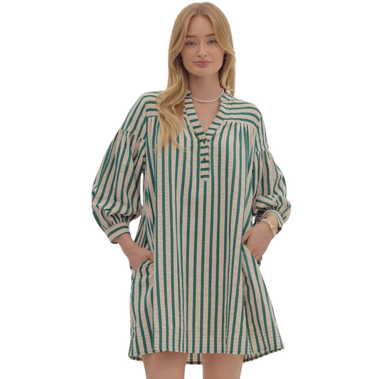 Expertly crafted for modern fashion, our Striped Drop Shoulder Dress features a timeless stripe design, 3/4 length sleeves, and functional pockets. With its elegant button details and lightweight woven fabric, this dress is a versatile choice for any occasion. Stay comfortable and stylish all day in timeless hunter green.