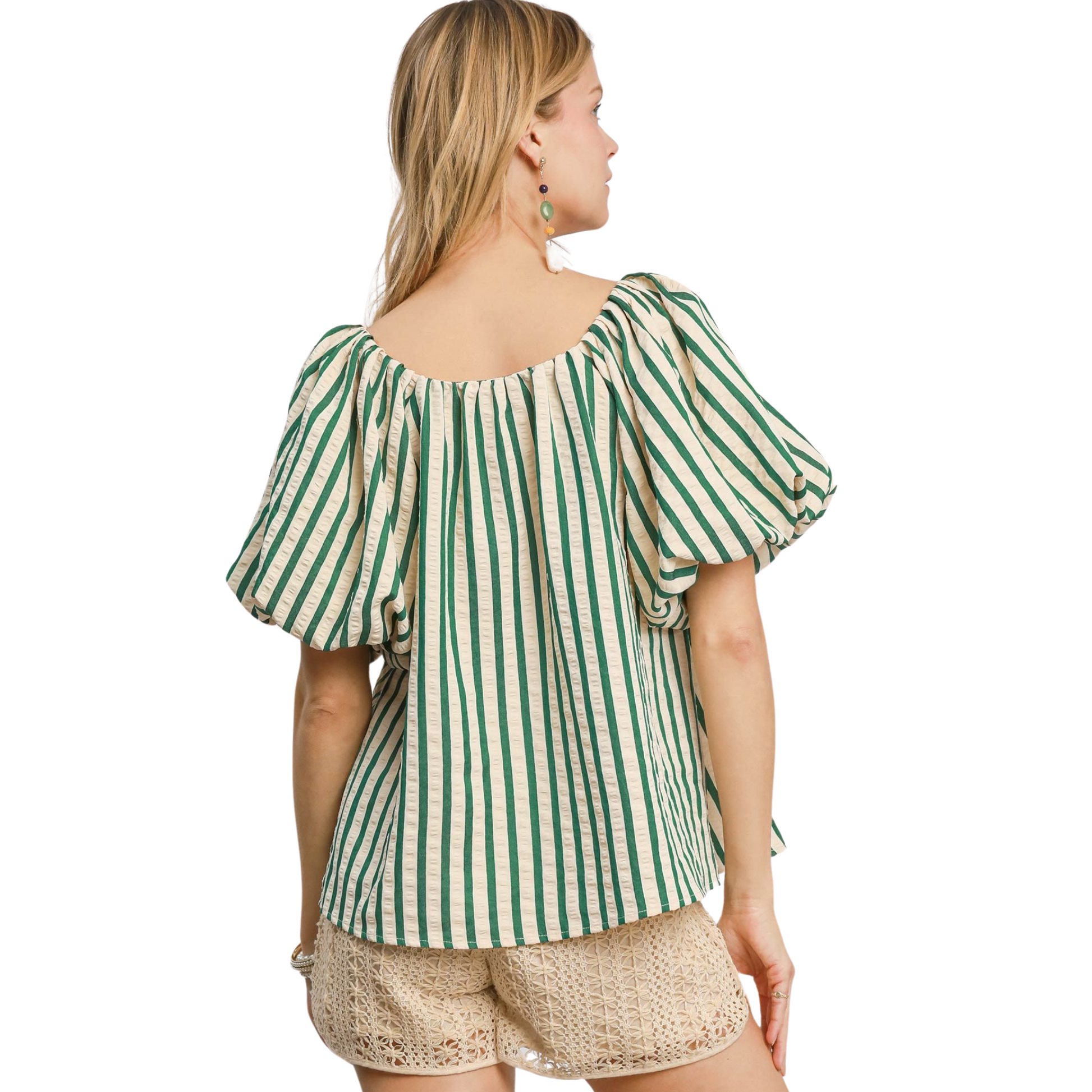 This Umgee Shirred Detail Top features a beautiful combination of green and beige, creating a classic and versatile color scheme. The short sleeves provide a comfortable and functional fit, while the bow accent adds a touch of feminine charm. A must-have addition to any wardrobe.