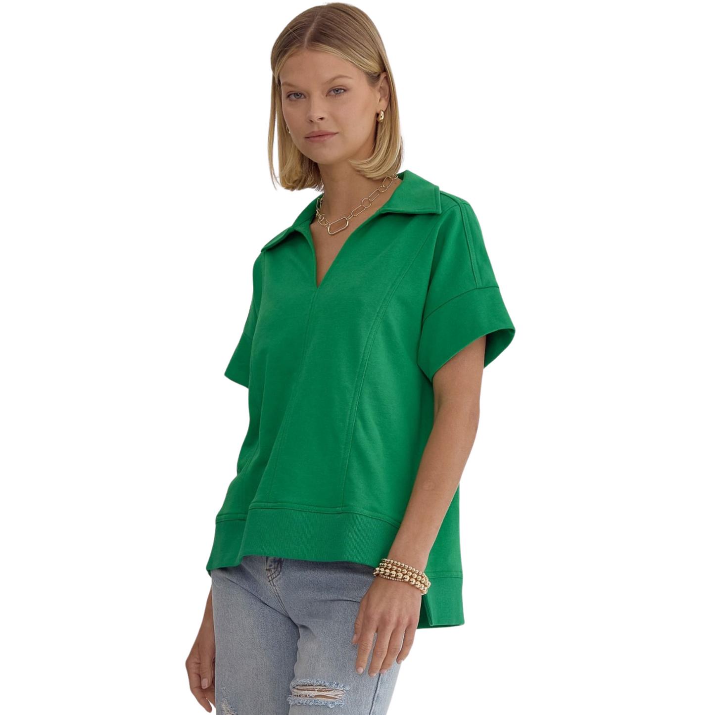 This solid short sleeve v-neck collared top is the perfect addition to your wardrobe. The split at the side hem adds a modern touch while the lightweight and non-sheer fabric ensures comfort and versatility. Complete your look with this essential piece.