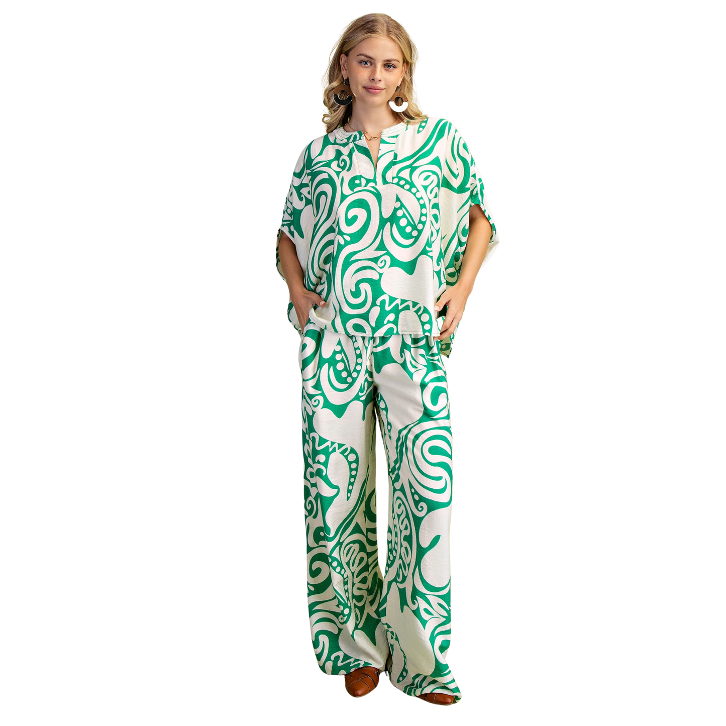 Elevate your casual wardrobe with this GiGio printed set featuring a striking green abstract design. The relaxed-fit top pairs perfectly with matching bottoms for an effortless, coordinated look. Soft, breathable fabric and short sleeves make it ideal for everyday comfort. Perfect for lounging, running errands, or casual outings.