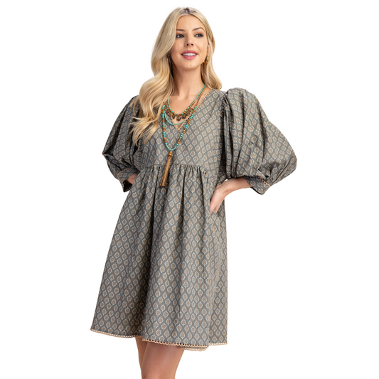 This GiGio babydoll mini dress features a sophisticated grey abstract print, tailored with a flattering V-neckline that enhances elegance. Its lightweight fabric and loose silhouette offer both comfort and style, making it ideal for warm-weather occasions or layering. Expertly designed, this dress balances playful charm with modern appeal, perfect for those seeking a versatile and fashion-forward addition to their wardrobe.