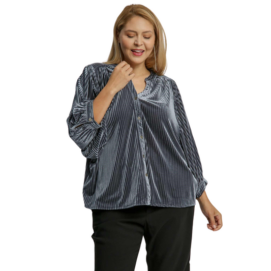 Expertly crafted with a gunmetal grey color, this V-Notched Button Down Top exudes a touch of sophistication. The soft velvet material and 3/4 length sleeves provide comfort and style, while the plus size ensures a flattering fit for any body type. Elevate your wardrobe with this versatile and elegant top.