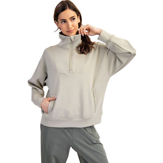 Modal Scuba Fleece Neck Pullover in light sage delivers understated sophistication with practical versatility. The half-zip design allows easy temperature regulation, while the long sleeves provide coverage for layering or standalone wear. Crafted from modal scuba fleece, this Rae Mode piece combines a soft hand-feel with structured support. The neutral sage tone pairs effortlessly with your existing wardrobe, making it an essential layering piece for transitional seasons or casual everyday styling.