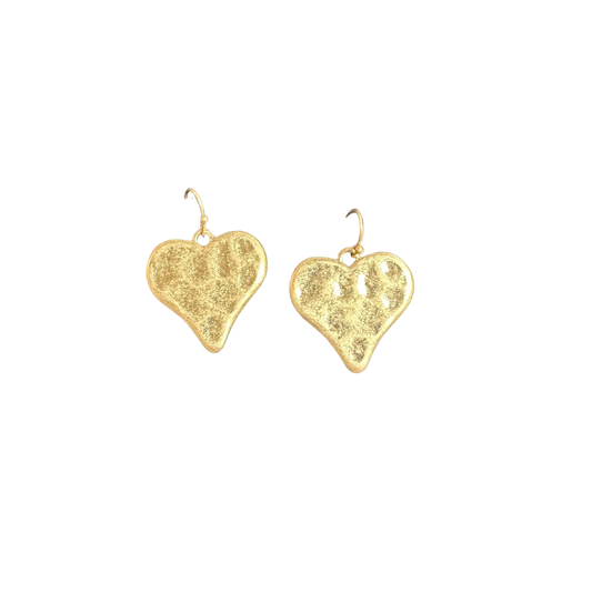 Elevate your jewelry collection with these exquisite Heart Dangle Earrings from Perdido Gems. Crafted in lustrous gold, each piece features a beautifully hammered heart design that catches light with subtle dimension and movement. The delicate dangle style adds graceful motion to every wear, making these earrings perfect for both everyday elegance and special occasions. The artisanal hammered finish showcases expert craftsmanship, while the timeless heart motif ensures enduring appeal. A sophisticated choic