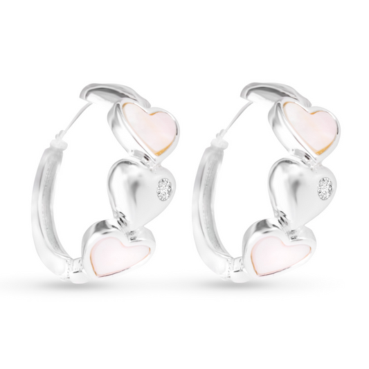 Expertly crafted, these Heart Hoop Earrings feature a delicate lining of hearts and sparkling rhinestone accents. The small hoops are perfect for everyday wear, adding a touch of elegance to any outfit. Made with silver, these earrings are both stylish and versatile.