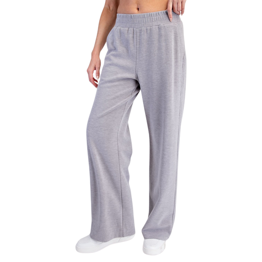 Elevate your everyday wardrobe with these Rae Mode Ribbed Brush Straight Pants. Crafted in a soft heather grey hue, these trousers feature a comfortable elastic waist and a timeless straight silhouette that works for any occasion. The brushed fabric offers a luxurious feel against the skin, while the classic cut pairs effortlessly with your favorite tops. Perfect for casual outings or relaxed workdays, these pants deliver both style and comfort.