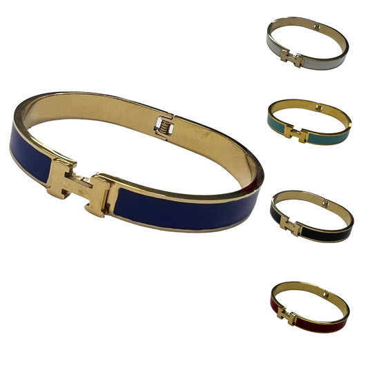 Elevate your accessory game with our Hermes Inspired Cuff Bracelet. This sleek and stylish cuff bangle is available in five stunning colors - green, navy, black, red, and white - to match any outfit. The cuff style offers a comfortable fit while adding a touch of sophistication to your look.