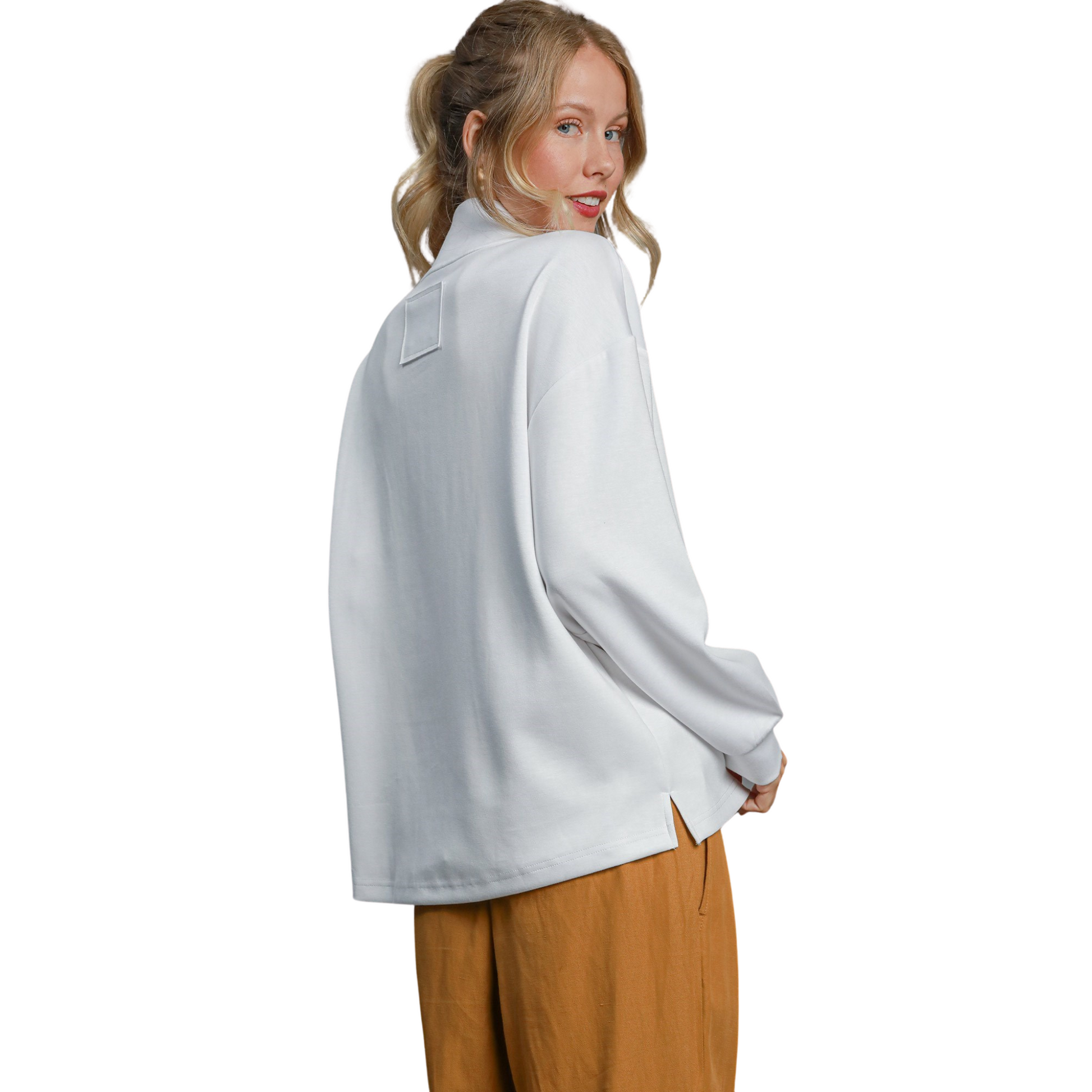 Upgrade your wardrobe with the Umgee High Neck Sweatshirt. In crisp white, this half-zip pullover top is the perfect blend of style and comfort. Stay warm and stylish all day long with this must-have piece from the trusted Umgee brand.