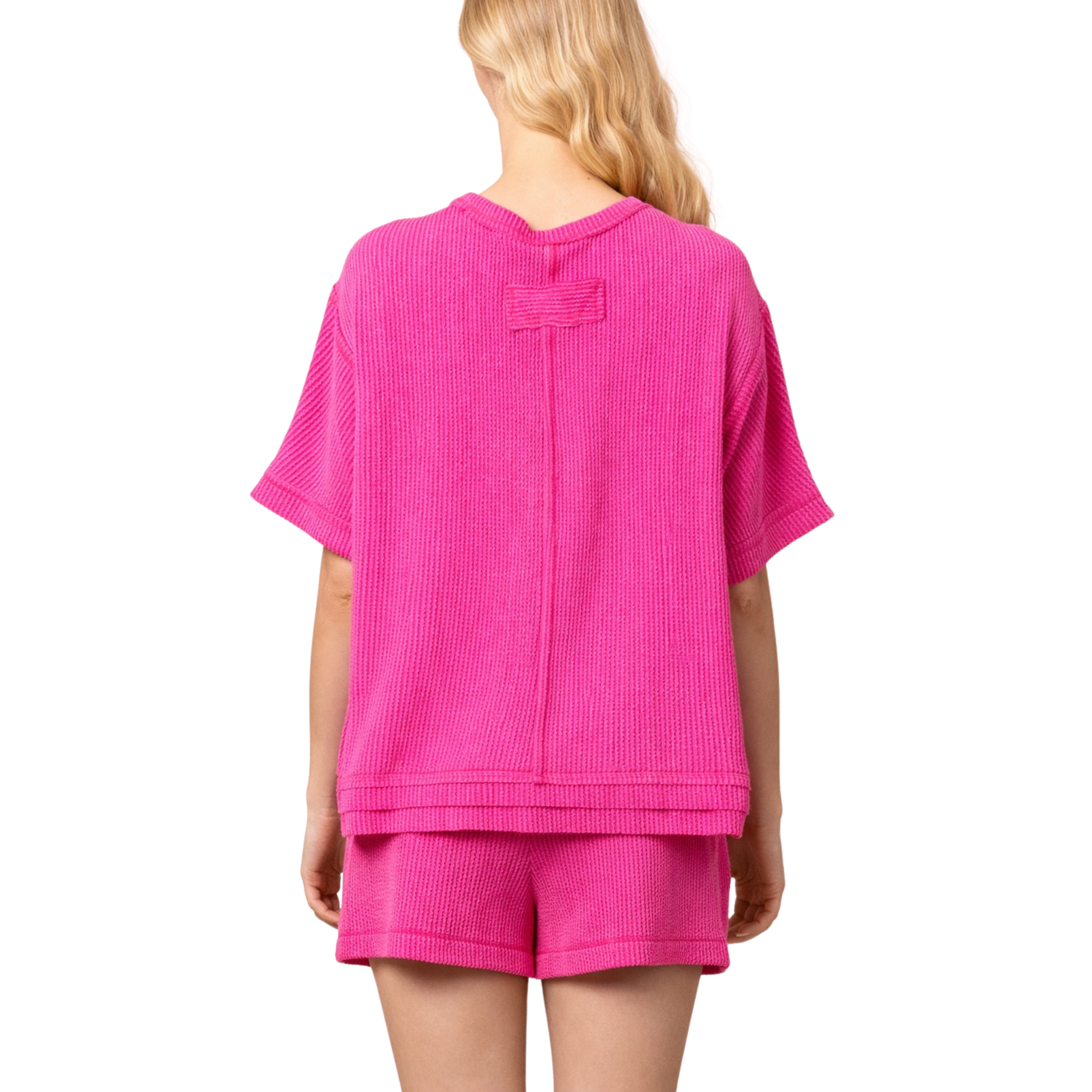 Elevate your casual wardrobe with this vibrant hot pink set from Very J. The textured short sleeve top pairs perfectly with matching shorts for an effortless, coordinated look. Soft fabric and thoughtful construction make this set ideal for warm weather styling, whether you're running errands or enjoying time with friends. A versatile essential that brings color and texture to your everyday rotation.