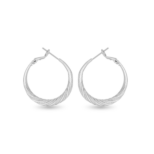 Expertly crafted with silver, these Ivy Twisted Hoops are a must-have accessory. The small hoops feature a unique twisted design that adds texture and dimension, making them perfect for any occasion. Elevate your style with these timeless and versatile earrings.