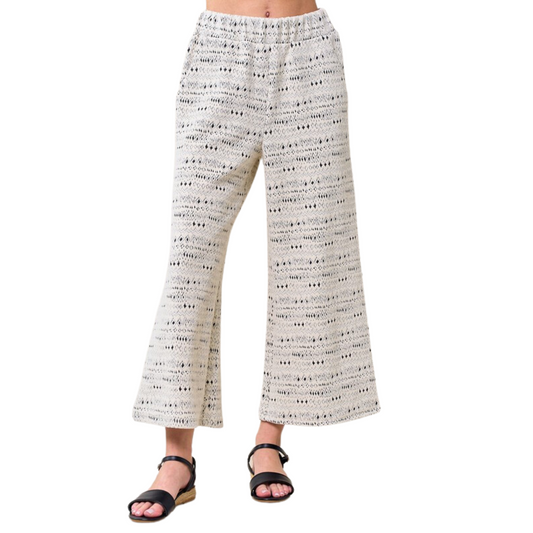 These plus size Jacquard Textured Pants feature an elastic waist and a wide leg for a comfortable, flattering fit. Crafted from a cream and grey jacquard fabric with an abstract print, they add a modern touch to any outfit.