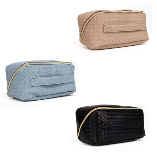 The Jolee Cosmetic Bag by The Royal Standard offers a refined solution for organizing your beauty essentials on the go. Available in black, light brown, and blue, its textured finish combines durability with sophisticated style. Expertly crafted, this travel bag ensures your cosmetics stay secure and accessible, making it an essential companion for both daily use and travel.