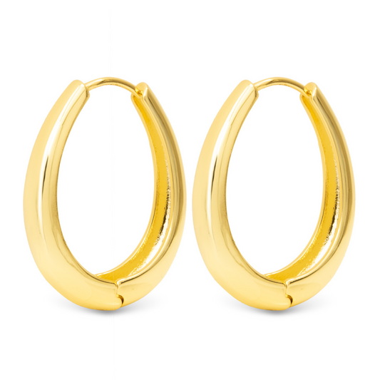 Achieve effortless elegance with the Judith Large Oval Hoops by Amanda Blu. Made with high-quality gold, these oval hoop earrings add a touch of sophistication to any outfit. Complete your look with these timeless and versatile accessories from a trusted brand.