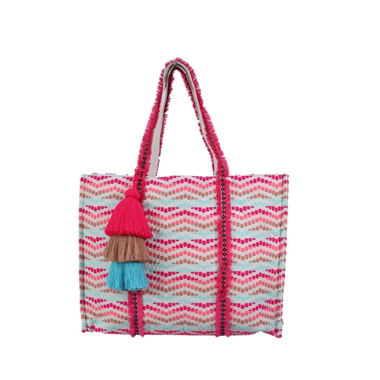 Expertly crafted from woven patterned cotton, the Karla Cotton Tote boasts a snap closure for secure storage. Enhanced by large triple tassels and fringe detailing, this tote is a stylish yet functional accessory. Available in a vibrant turquoise and pink color scheme.