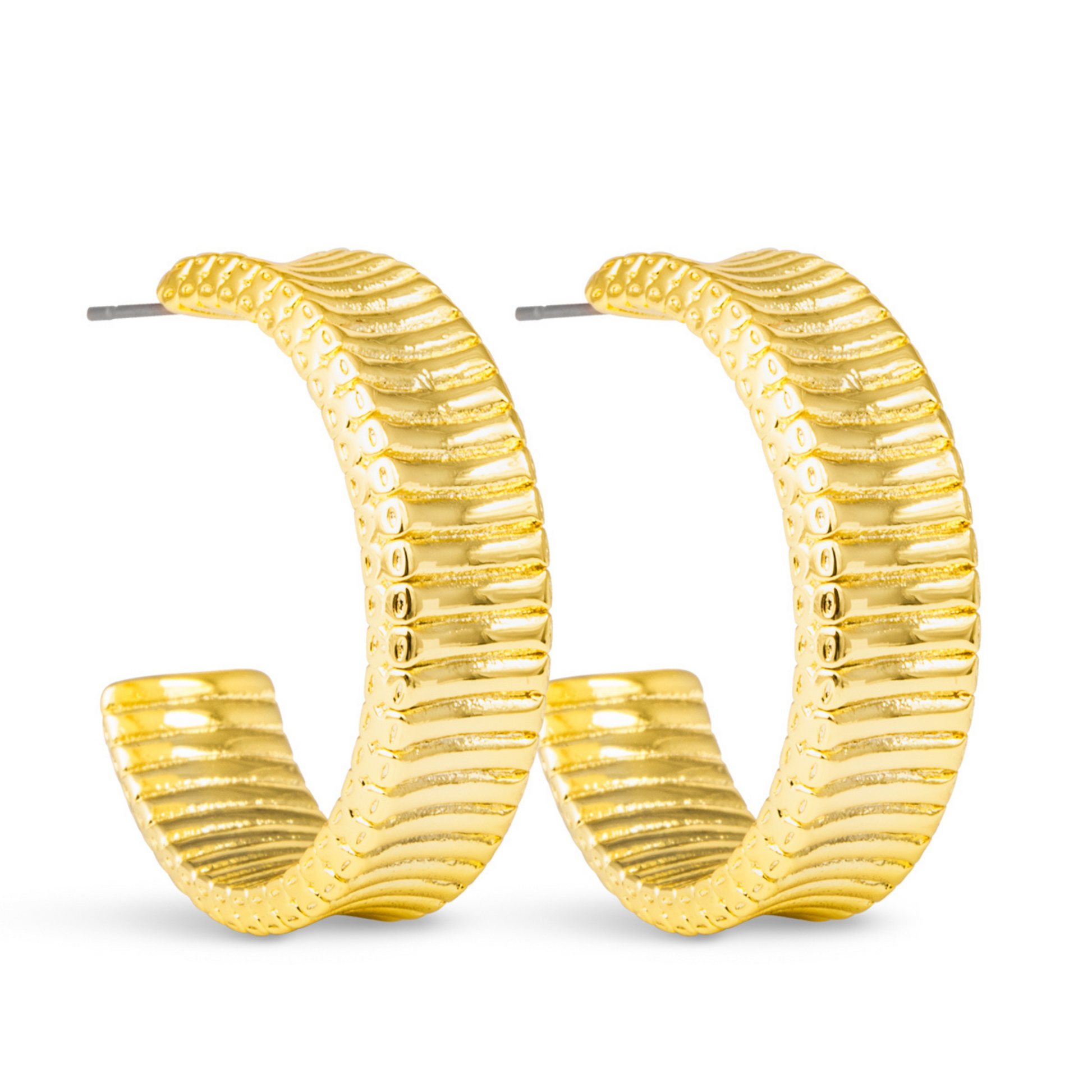 Introducing Kennedy Ribbed Hoops by Amanda Blu. These medium-sized hoops feature a unique ribbed design, adding a touch of texture to your look. Crafted in luxurious gold, these hoops will elevate any outfit. Upgrade your accessory collection with Amanda Blu.