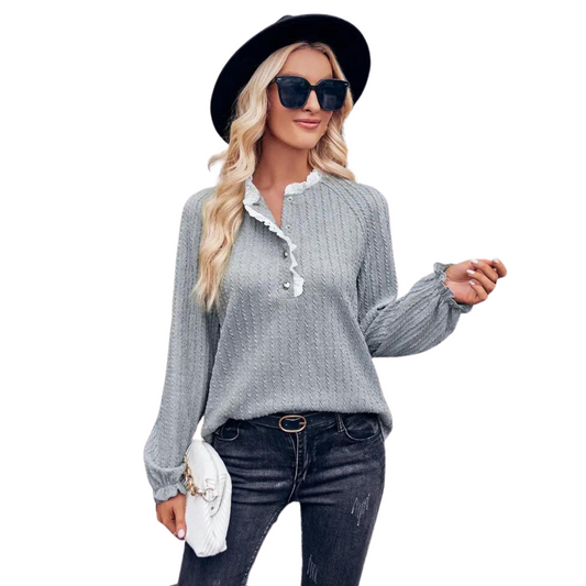 This Textured Long Sleeve Blouse is a stylish piece for casual, fall events. Featuring a loose fit and made with a textured fabric in a grey hue, it's detailed with delicate lace panels. Perfect for adding a touch of style to your look.