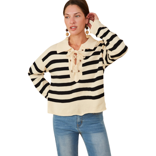 Featuring a classic collar neckline and lace up detailing, this Women's Striped Knit Sweater from Hayden Los Angeles adds a touch of sophistication to your wardrobe. The black and cream color combination and soft knit fabric make it versatile and comfortable for any occasion. Elevate your style with this must-have piece.