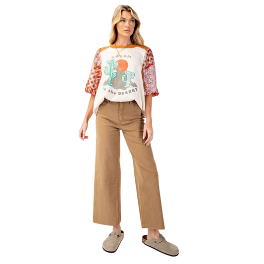 These Soft Stretch Twill Pants in a latte color combine comfort and style with a relaxed, loose fit and wide legs. Designed with practical features like belt loops, front and back pockets, as well as side pockets, they offer convenience for everyday wear. The lightweight fabric and raw cut bottom enhance breathability and a modern look. Finished with a secure zip fly and button closure, these Easel brand pants provide both ease and durability for versatile use.