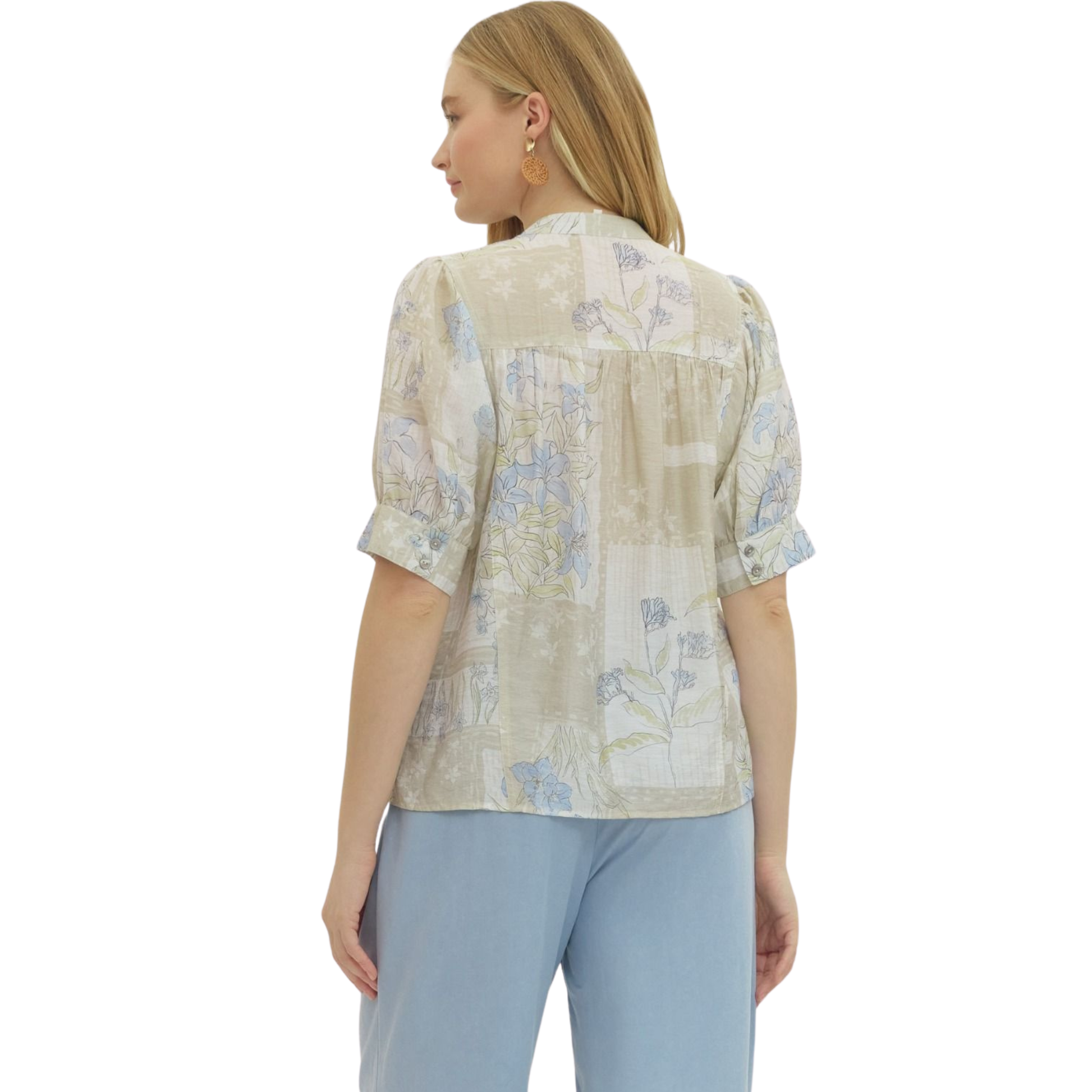 Elevate your everyday wardrobe with this charming Botanical Print Short Sleeve Top by Entro. Featuring a soft latte base adorned with delicate floral patterns, this collared button-down top combines timeless style with modern comfort. The classic silhouette and quality construction make it perfect for casual outings, office settings, or weekend gatherings. Versatile and effortlessly chic, this piece pairs beautifully with jeans, skirts, or trousers for endless styling possibilities.