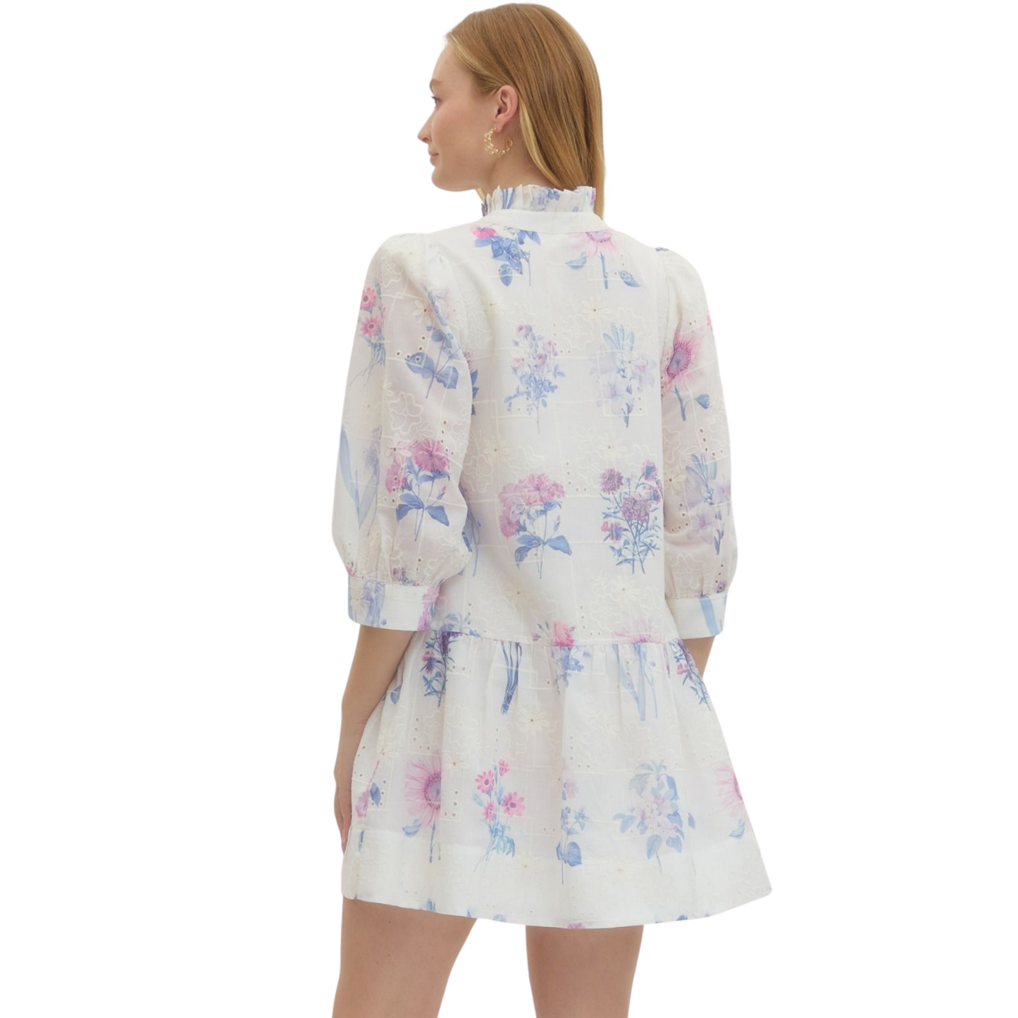 Elevate your spring wardrobe with this charming Floral Print Mini Dress by Entro. Featuring a delicate lavender floral design, this piece combines feminine style with everyday comfort. The flattering V-neckline and three-quarter length sleeves offer a sophisticated silhouette, while the mini length keeps things fresh and modern. Perfect for casual outings, brunch dates, or weekend adventures. Versatile enough to dress up with heels or down with sneakers.