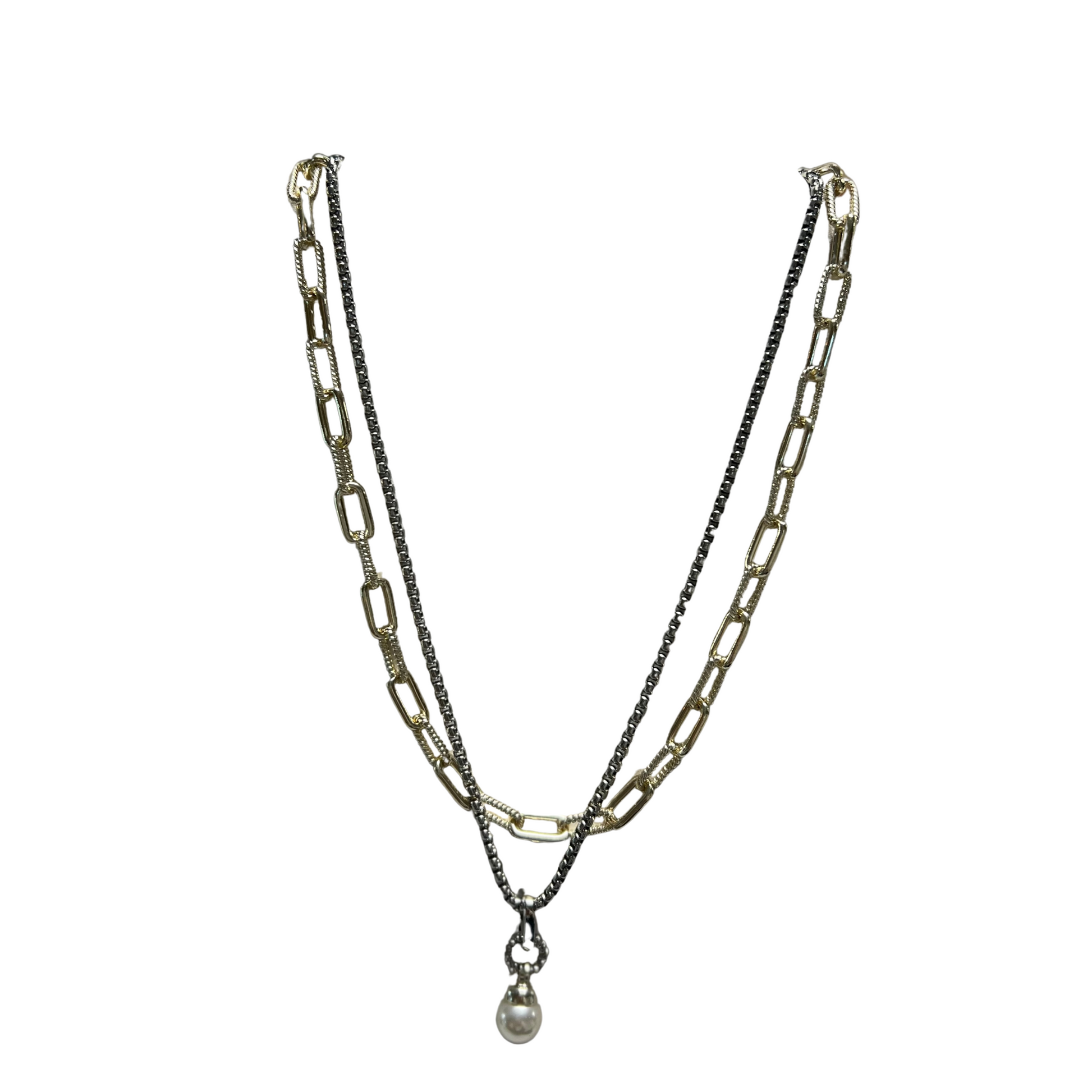 This layered pearl accent necklace features a gold and silver combo with a chain link design. The pearl accent adds a touch of elegance, making it a perfect accessory for any occasion. The short layered style adds a modern twist to classic pearls.