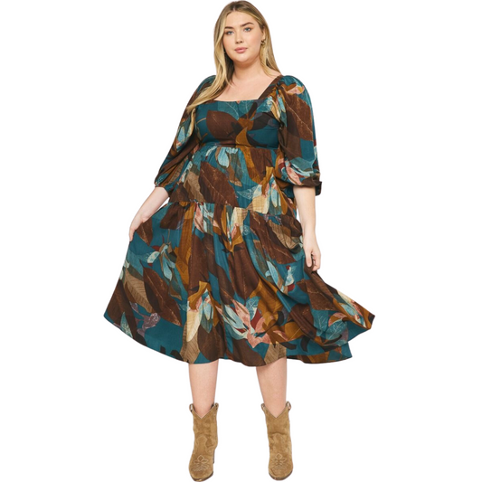 This classic Leaf Printed Maxi Dress features a square neckline, 3/4 length sleeves, and smocked detailing at the back for a comfortable fit. The lightweight, non-sheer, woven fabric is adorned with a stylish leaf print. Perfect for any special occasion.