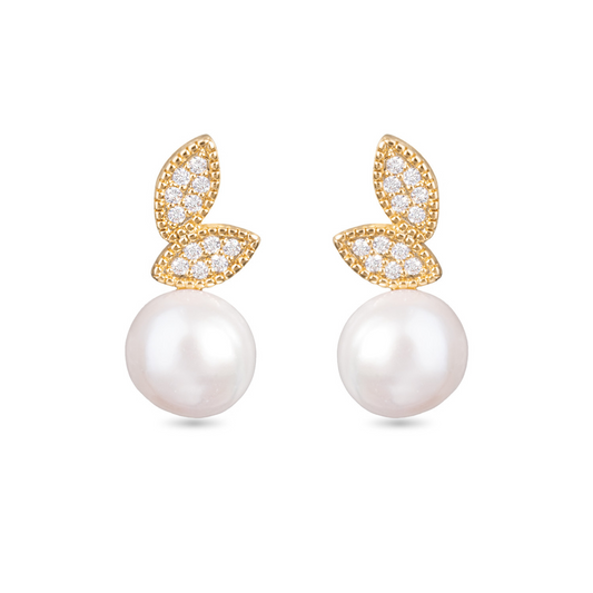 Add a touch of elegance to your outfit with our Leaf with Pearl Studs. Crafted in gold with rhinestone accents, these stunning earrings feature a delicate leaf design and a lustrous pearl to complete the look. Perfect for any occasion, these studs are sure to make a statement.