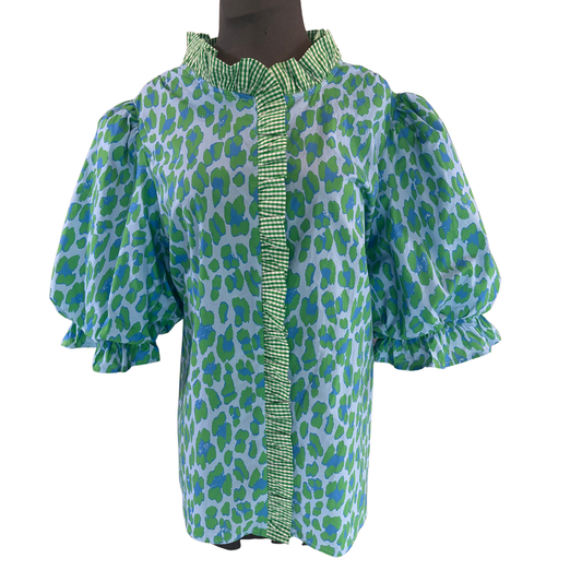Elevate your wardrobe with this striking Leopard Print Puff Sleeve Top by Entro. The bold leopard pattern blends rich blue and green tones for a unique, eye-catching aesthetic that stands out from traditional animal prints. Voluminous puff sleeves add a touch of feminine charm and contemporary flair, making this piece perfect for both casual outings and dressed-up occasions. The dynamic color combination ensures versatility—pair it with neutrals for understated elegance or bold separates for maximum impact.