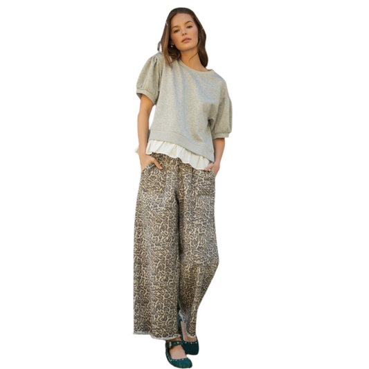 These Jodifl drawstring pants feature a stylish leopard print and a comfortable loose fit, ideal for all-day wear. The adjustable drawstring waist ensures a personalized fit, while side pockets add functionality without compromising style. Perfect for those seeking a blend of trend-forward design and practical comfort.
