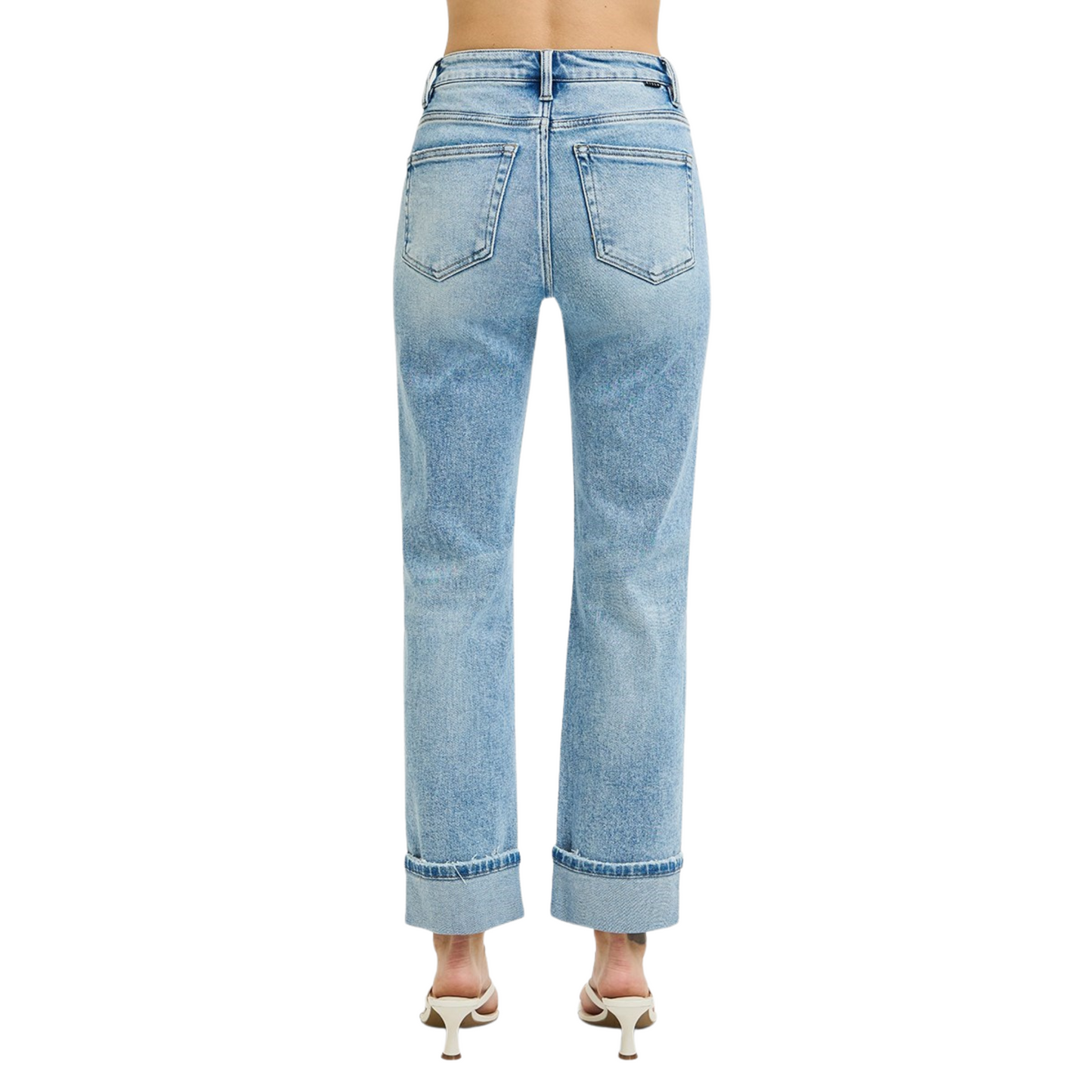 These High Rise Cropped Jeans from Risen offer a light wash and roll-up hem for a trendy look. The tummy control feature provides a flattering silhouette, making you feel comfortable and confident. Elevate your style with these must-have jeans.