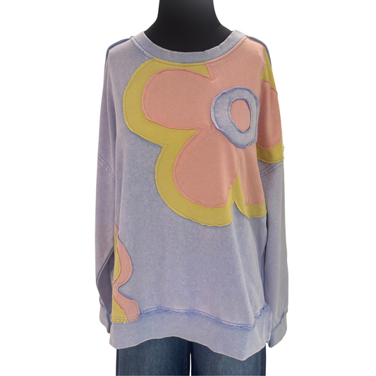 Crafted by Easel, this long-sleeved sweatshirt in a soothing lilac blue features intricate flower patch detailing that adds a delicate yet distinct touch. The soft fabric ensures comfort while the tasteful design elevates everyday wear, making it a versatile piece for both casual and refined looks.